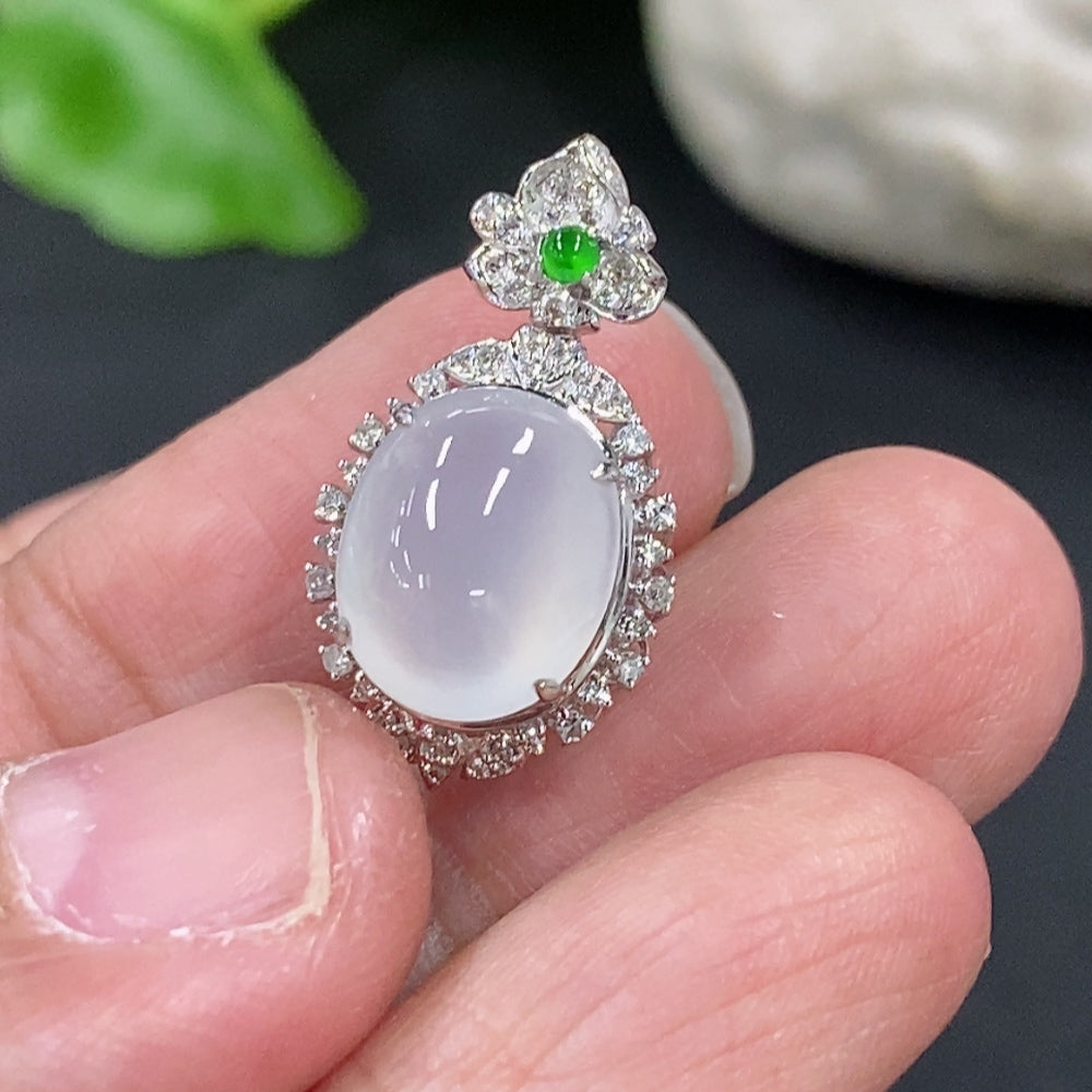 Jadeite cabochon pendant with 18K gold setting and diamond accents, crafted by HKHQ, featuring a polished green jade stone.
