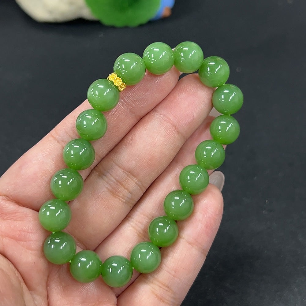Hetian jade bracelet by HKHQ featuring 9.6mm jade beads, total weight 30.1g, showcasing smooth, polished jade stones.