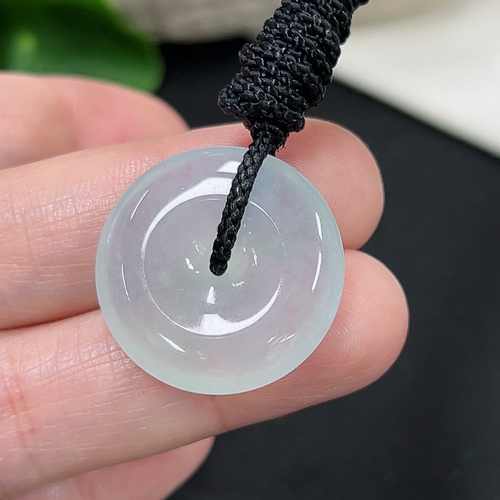Jadeite Peace Knot pendant with HKHQ branding, featuring a smooth green jade piece and a rope cord, weighing approximately 7.1g.
