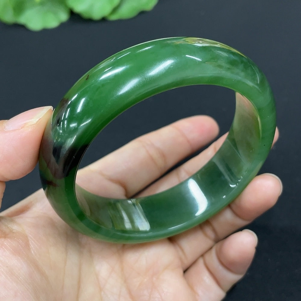 Green Hetian Jade round bangle bracelet by HKHQ featuring smooth polished surface and traditional circular design.