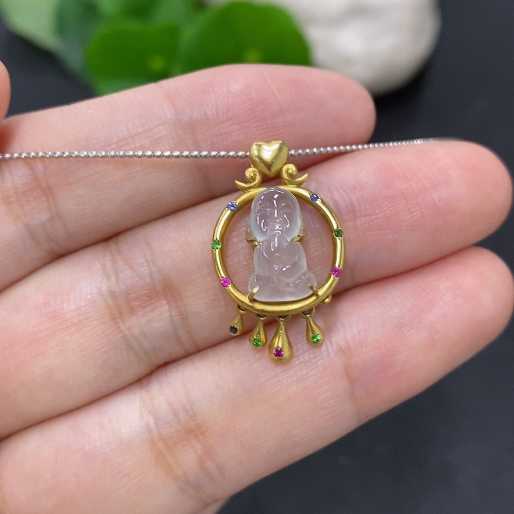 Jadeite inlaid pendant with 18K gold rope setting, featuring smooth jade stone and intricate gold detailing.