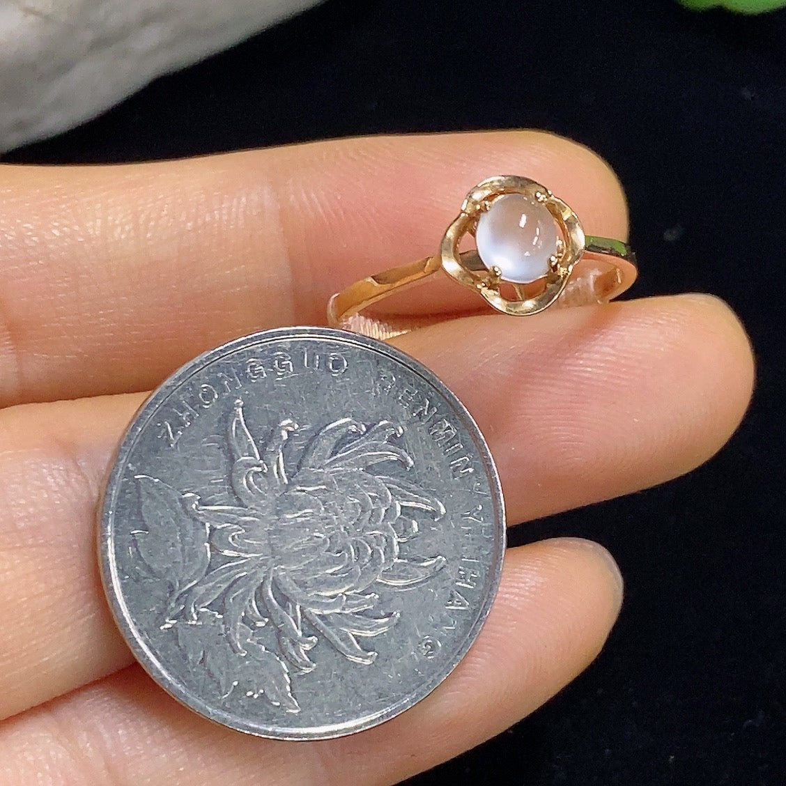 Jadeite cabochon solitaire ring with 18k gold setting, size 13, from HKHQ, showing the smooth, polished jade stone.