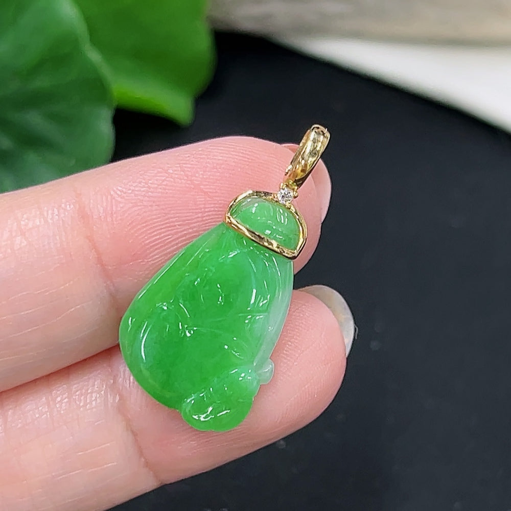 Jadeite pendant with 18k gold bezel and diamond accents, showcasing a smooth green jade stone, from HKHQ.