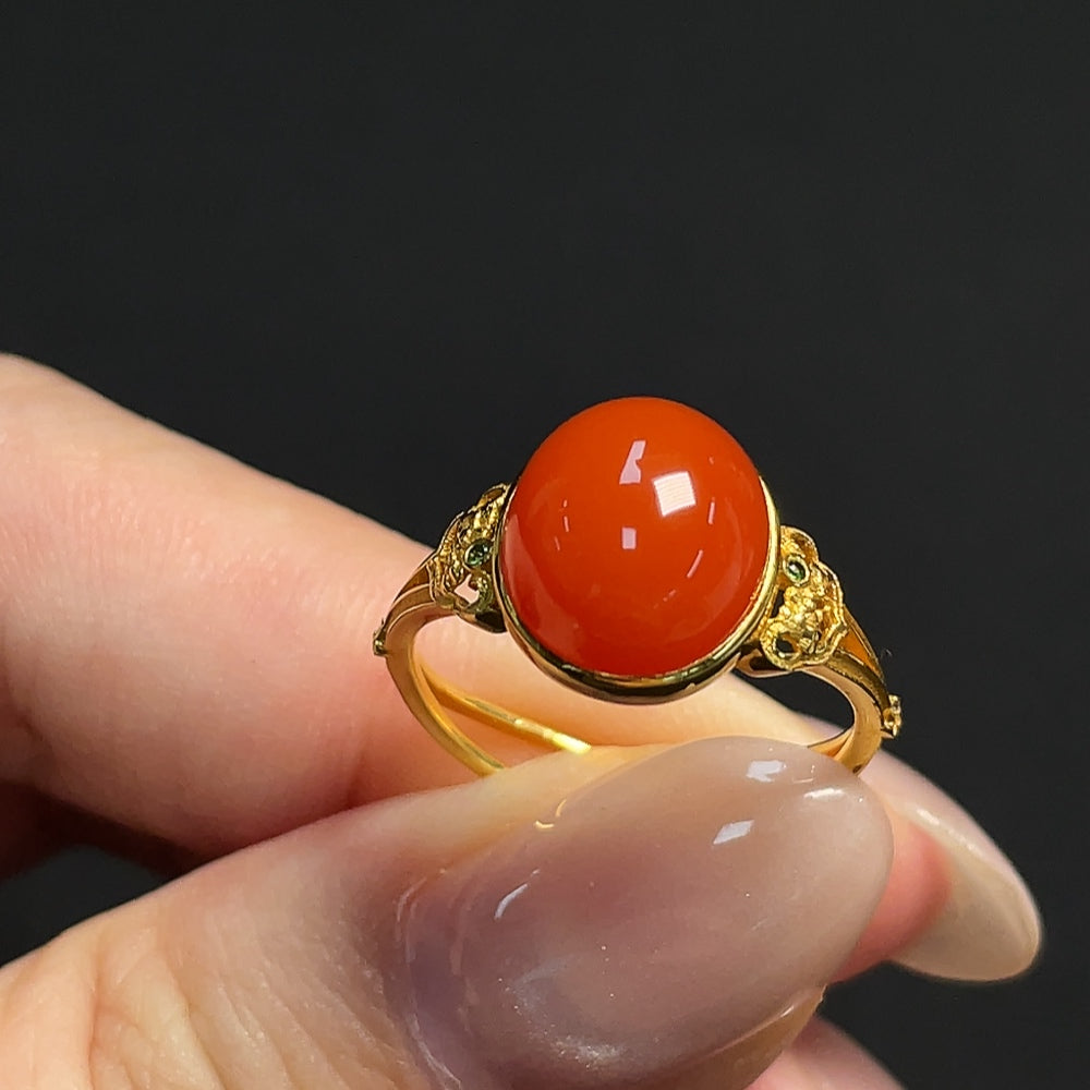 South red agate gemstone ring by HKHQ with 18k gold setting and accent stones, size 15, weight 3.11g, close-up view of the ring.