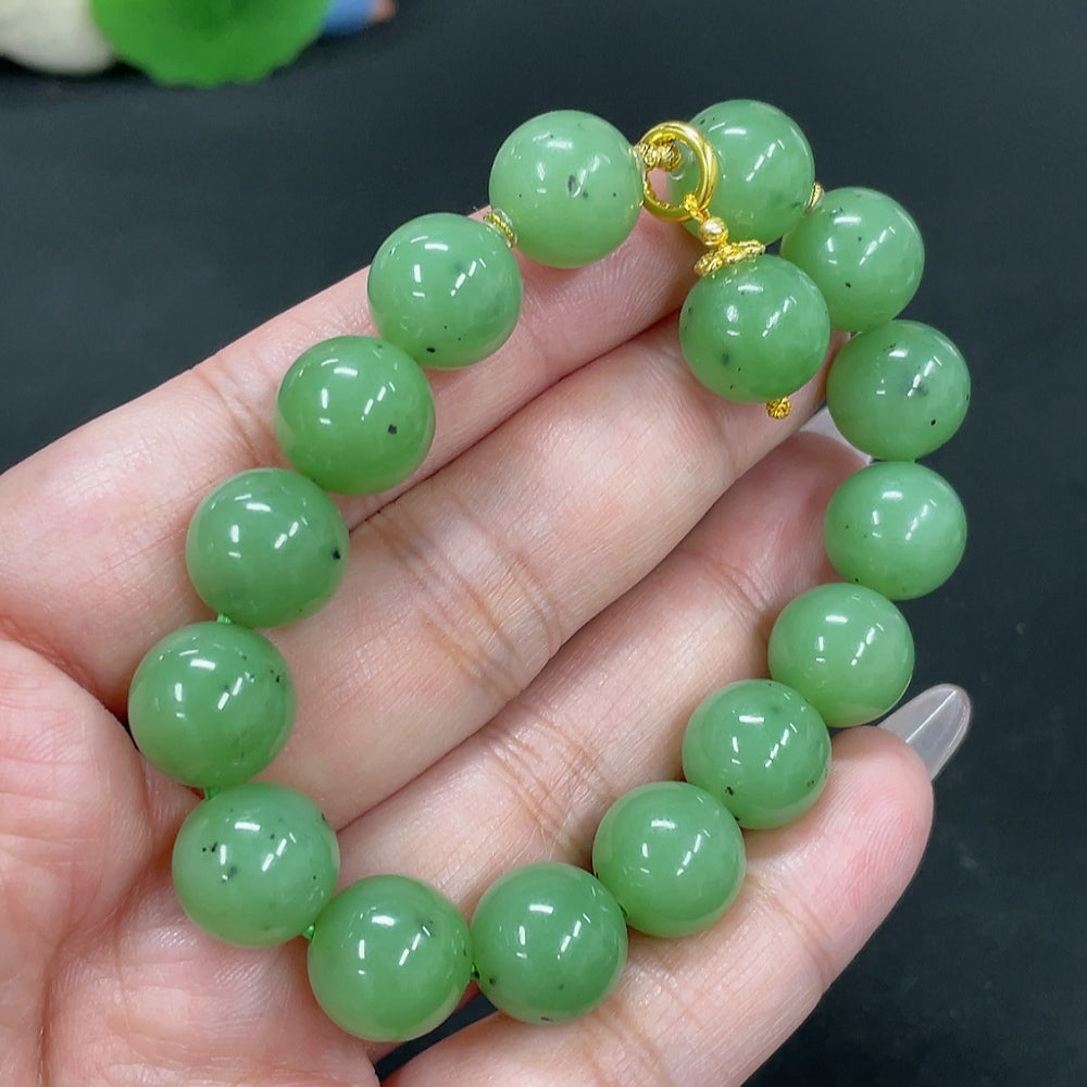 Hetian Jade Jasper bracelet with 11.9mm beads, 18k gold accents, weight 43.3g, featuring natural jade and red markings.