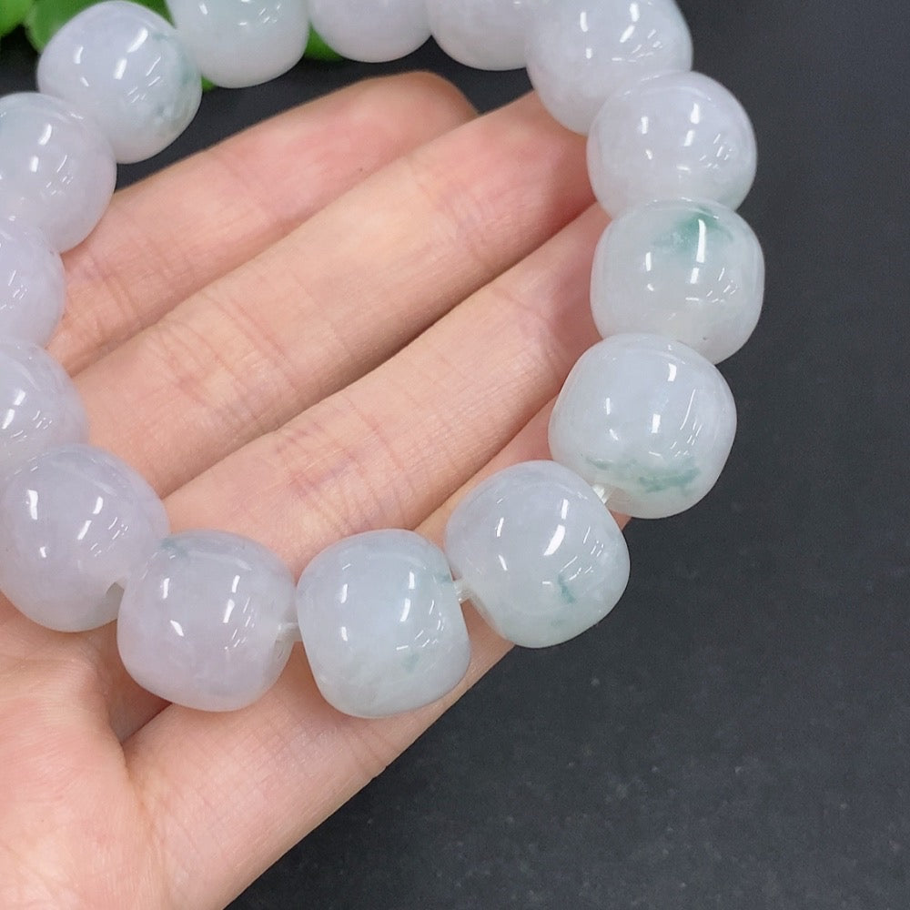 HKHQ Jadeite bracelet weighing 83.3g, featuring smooth, polished jadeite beads arranged in a stylish bracelet design.