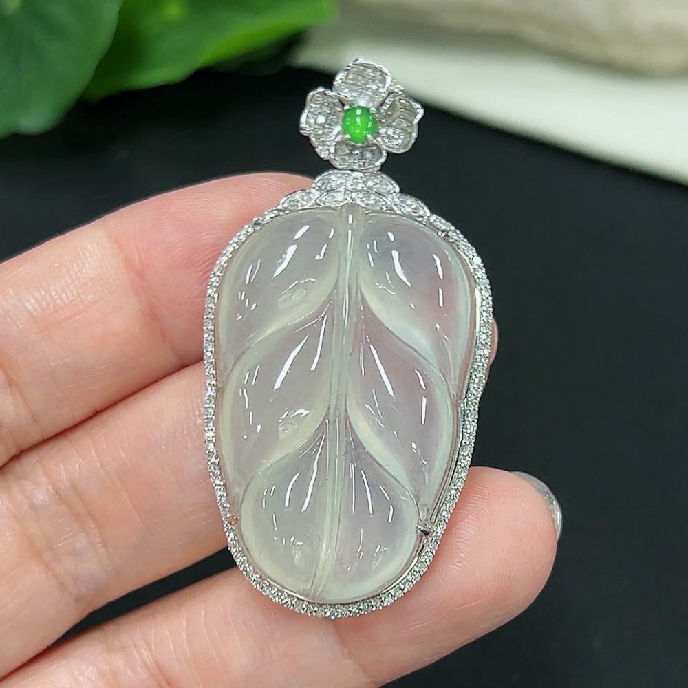 Jadeite leaf inlay pendant with diamond accents, 18K gold, from HKHQ, weighs approx. 11g, featuring detailed jade craftsmanship.