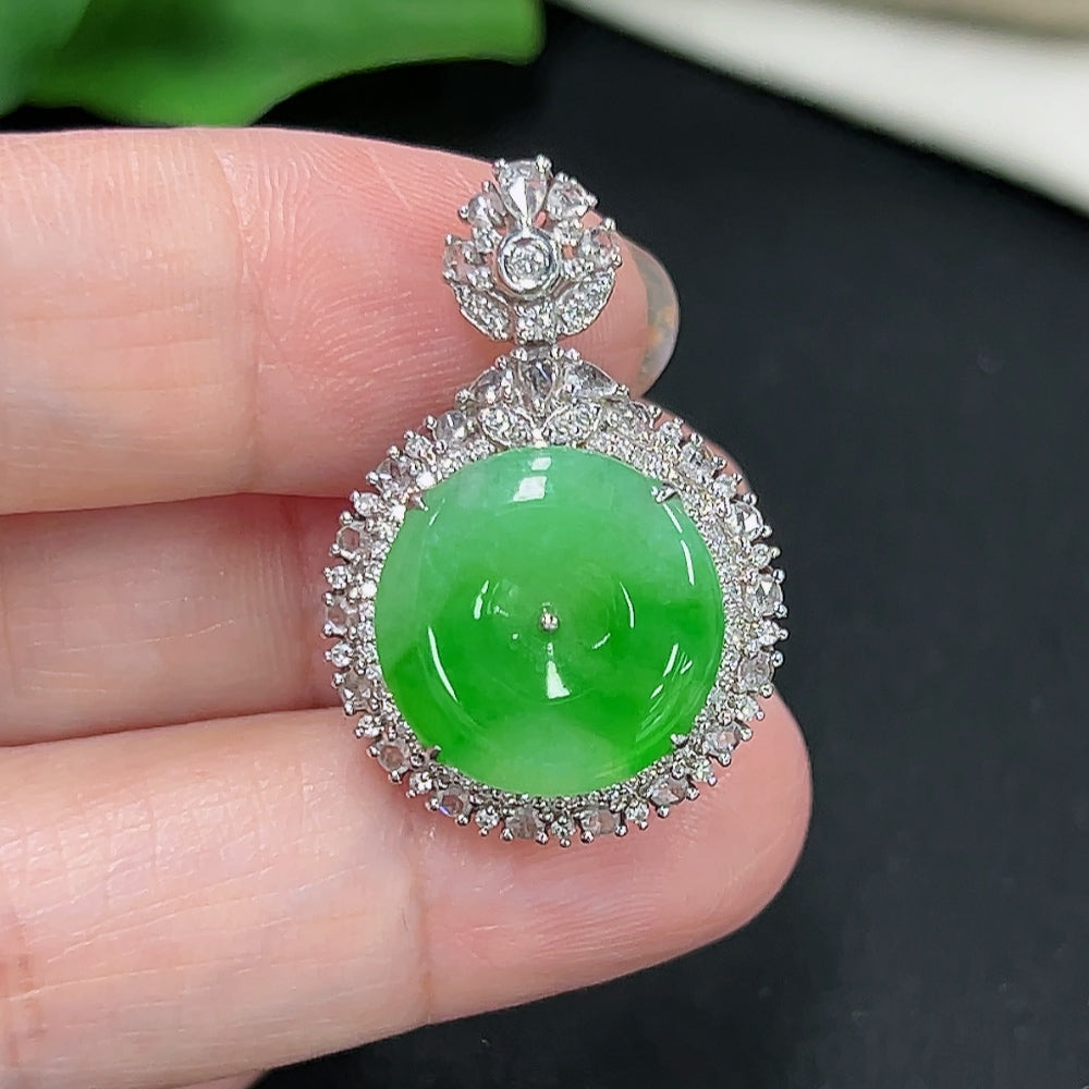 Jadeite pendant with 18K gold setting, accented with diamonds, weighing approximately 5.4 grams, from HKHQ.