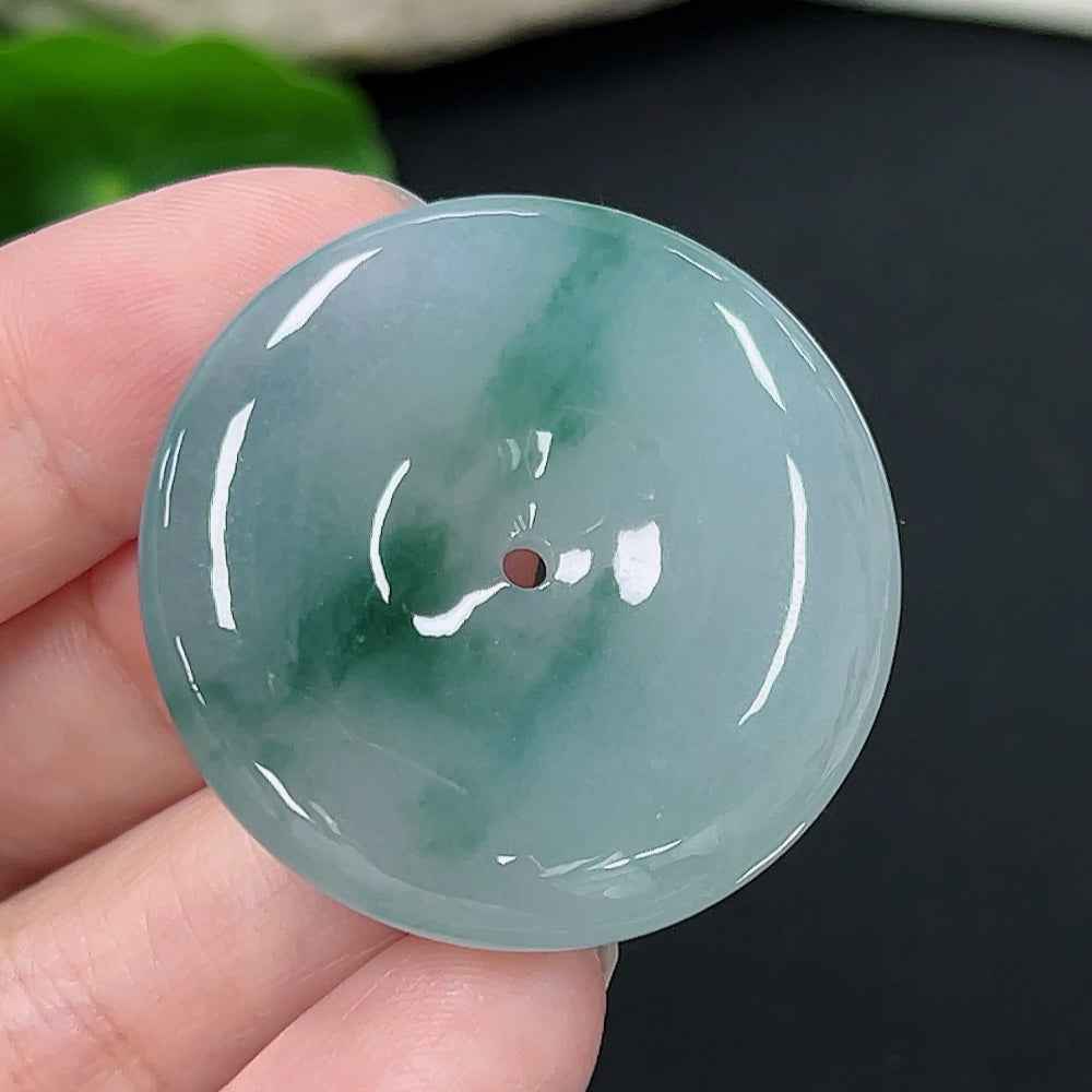 Jadeite Peace Knot pendant in green jade with intricate knot design, weighing approximately 18.9g, by HKHQ.