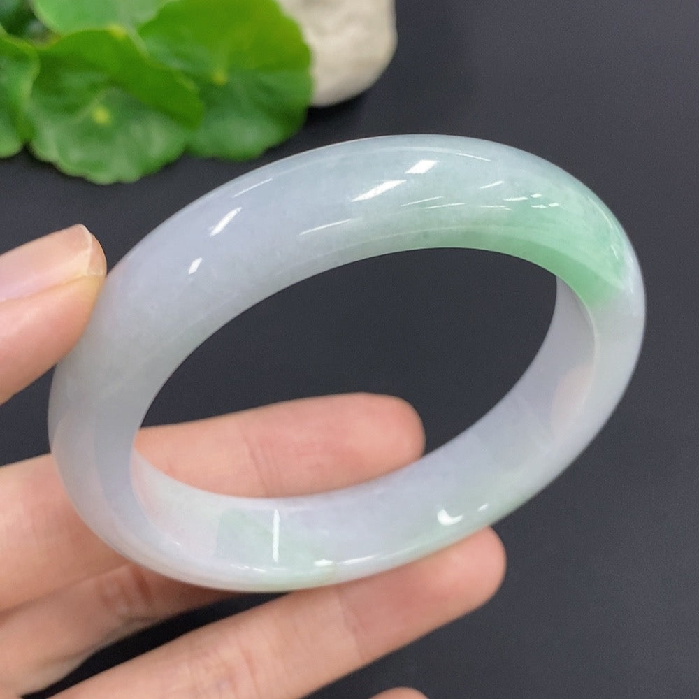 HKHQ jadeite round bangle, 61.2g, size 57, smooth green jade jewelry displayed on a neutral background.