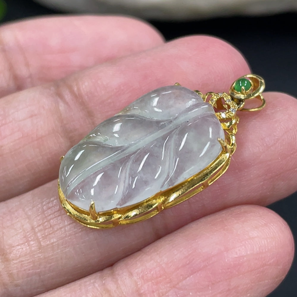 Jadeite leaf pendant in 18k gold with diamond inlays, weight approx. 2.17g, featuring intricate jade and gold craftsmanship.