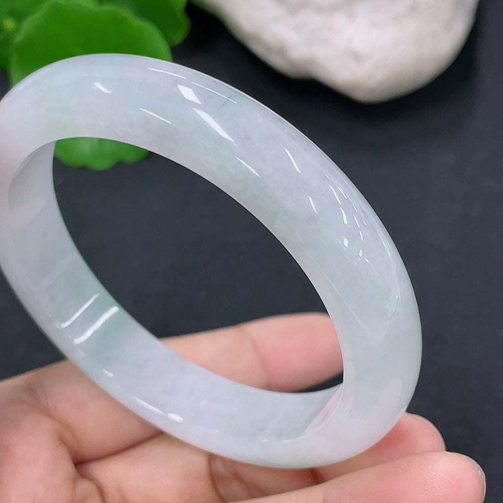 Jadeite round bangle in size 54.5mm with a total weight of 50.76g, crafted by HKHQ, featuring smooth, polished jade surface.