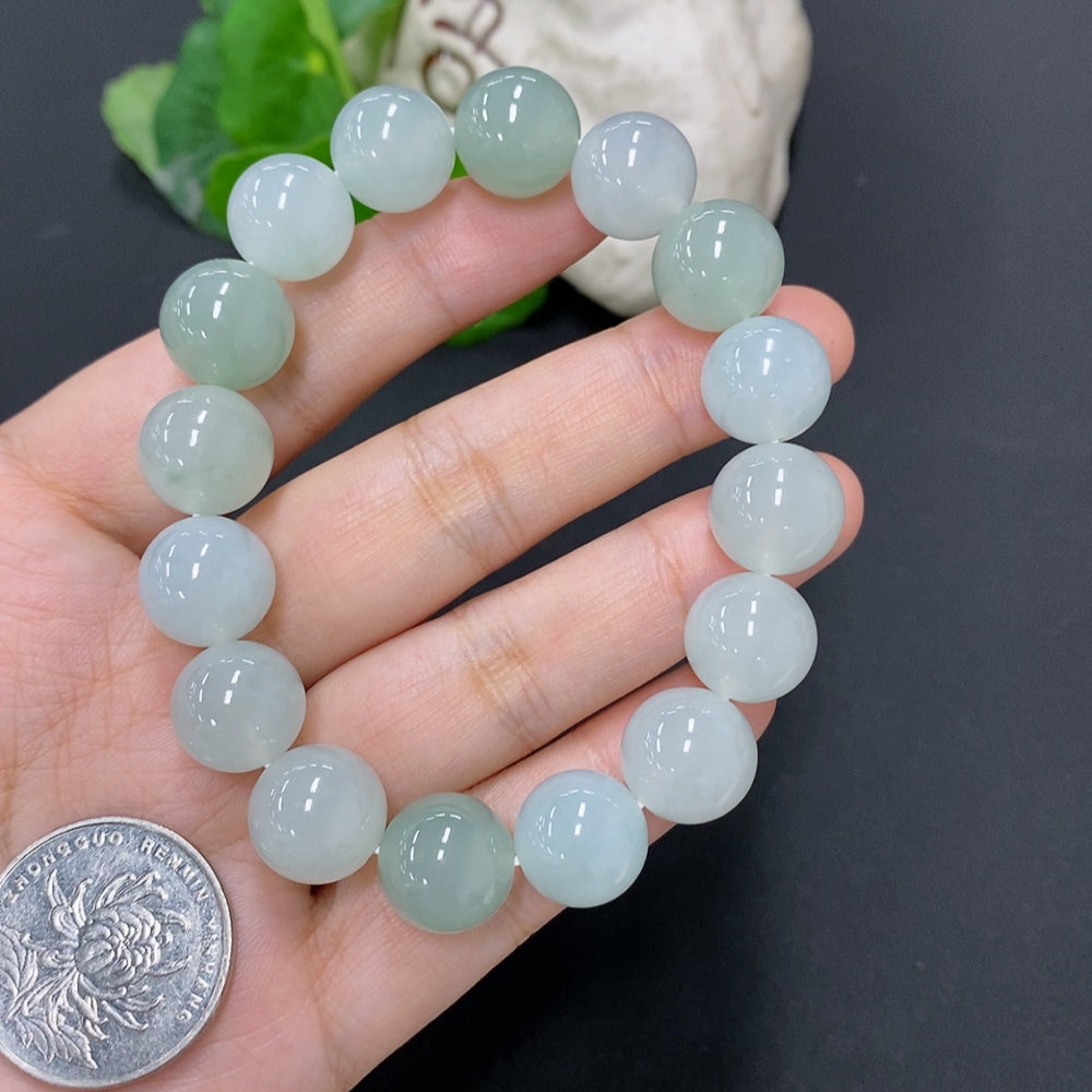 Jadeite bead necklace with large 12.7mm beads, weighing approximately 58g, featuring smooth, polished jade stones.
