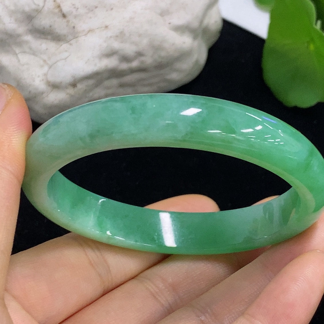 HKHQ Jadeite oval bangle in size 56.2 with 38.3g, showcasing smooth, polished jadeite with elegant oval shape.