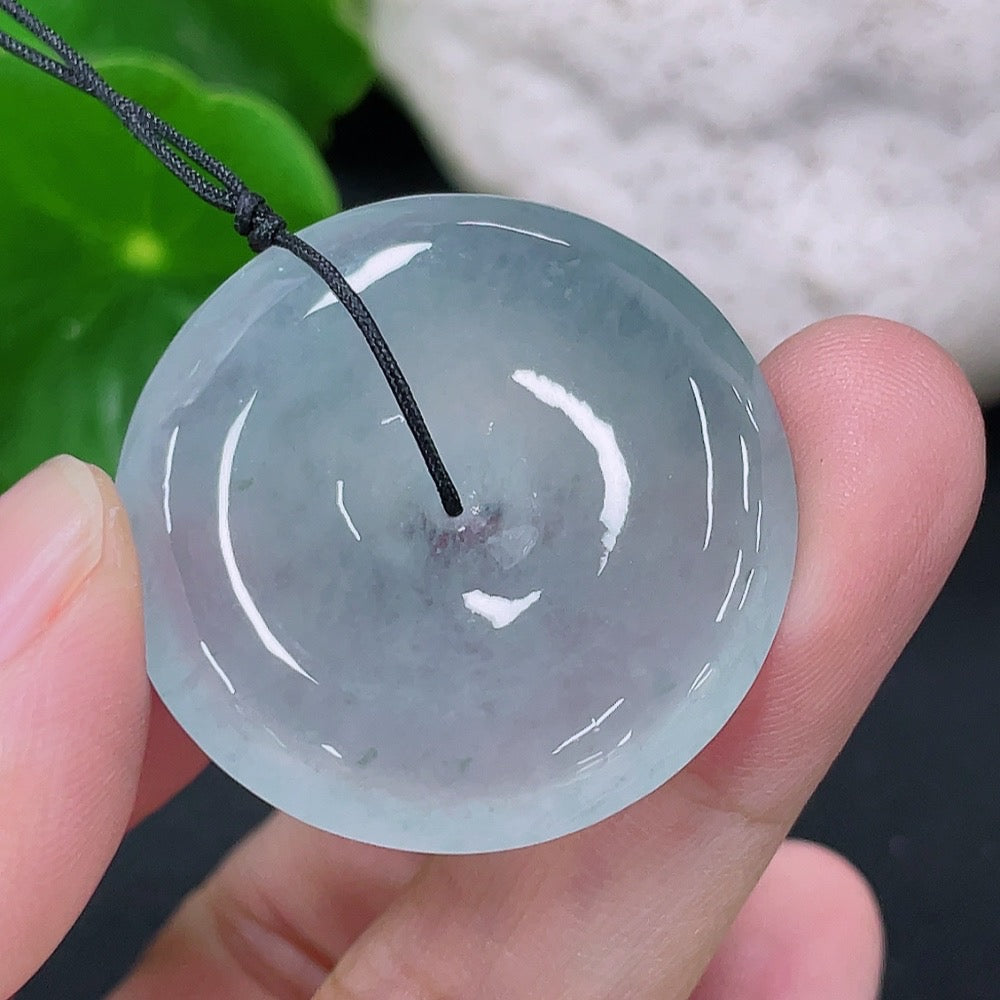 Jadeite pendant featuring a peace knot design, crafted from green jade, weighing approximately 9.72 grams, by HKHQ.