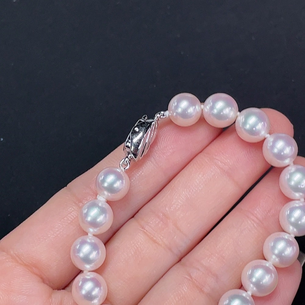 Saltwater pearl bracelet by HKHQ featuring elegant white pearls on a non-gold bracelet design.
