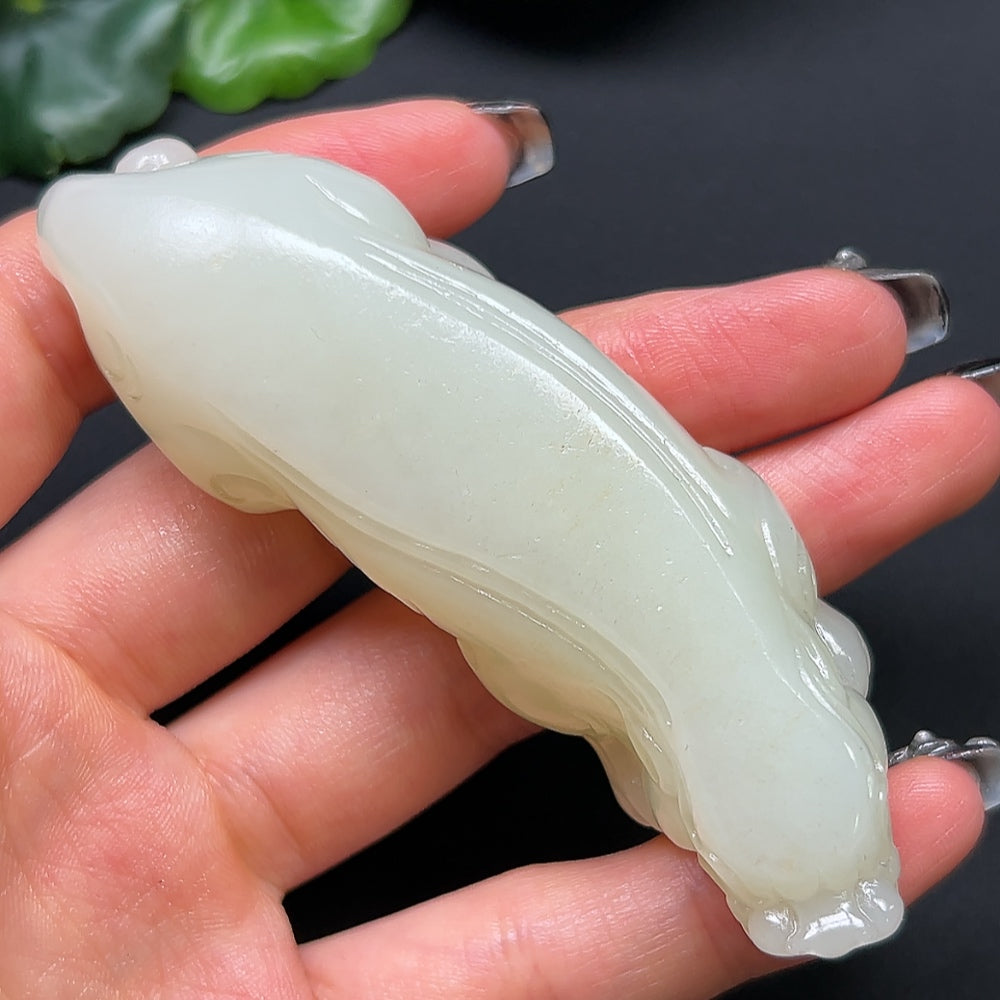 Hetian Jade Pixiu pendant from HKHQ, crafted in green jade, weighs approximately 80g, featuring detailed Pixiu carving.