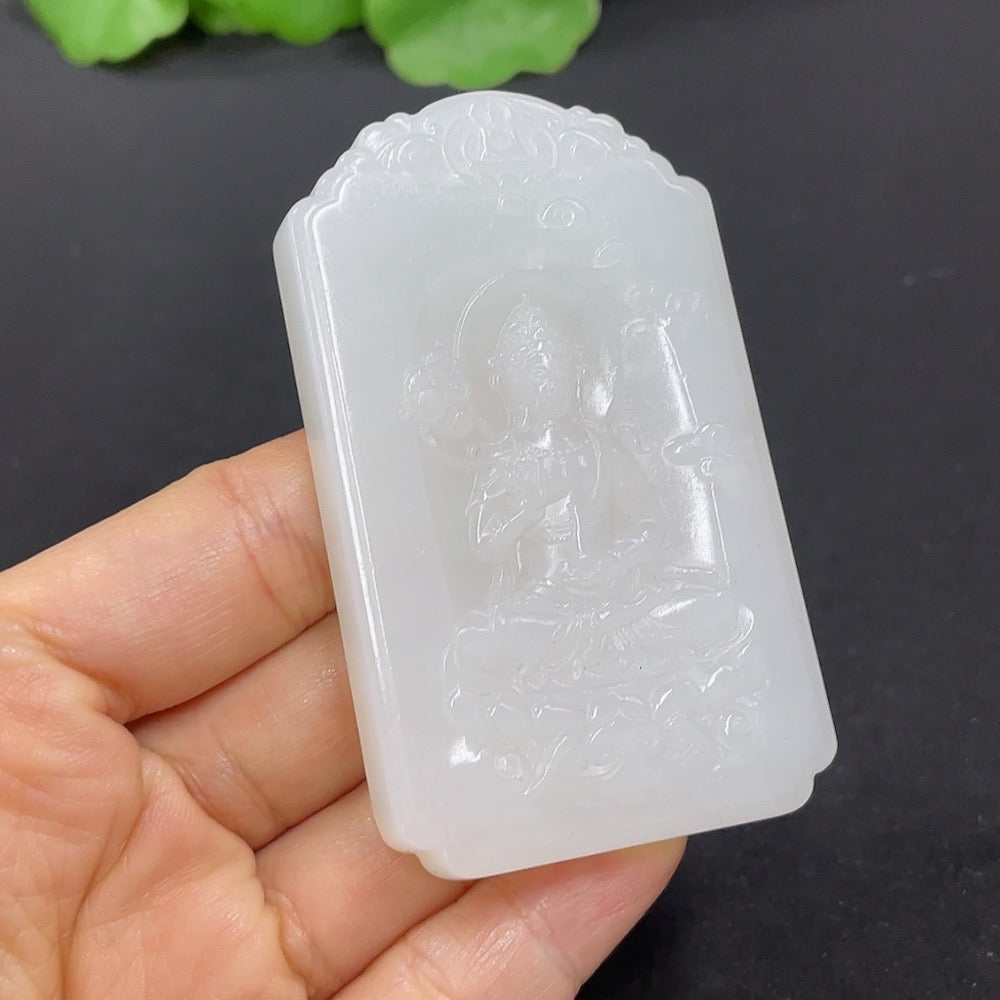 Hetian jade Guanyin pendant from HKHQ, weighing approximately 65.2g, featuring intricate carving and smooth jade surface.