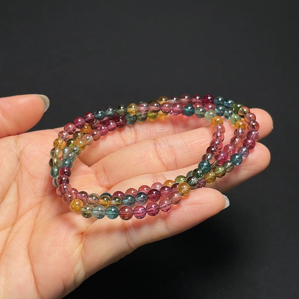 Tourmaline gemstone bead strand with organic matter, 4.3mm size, HKHQ brand, weighing approximately 18.99g, natural and unique.