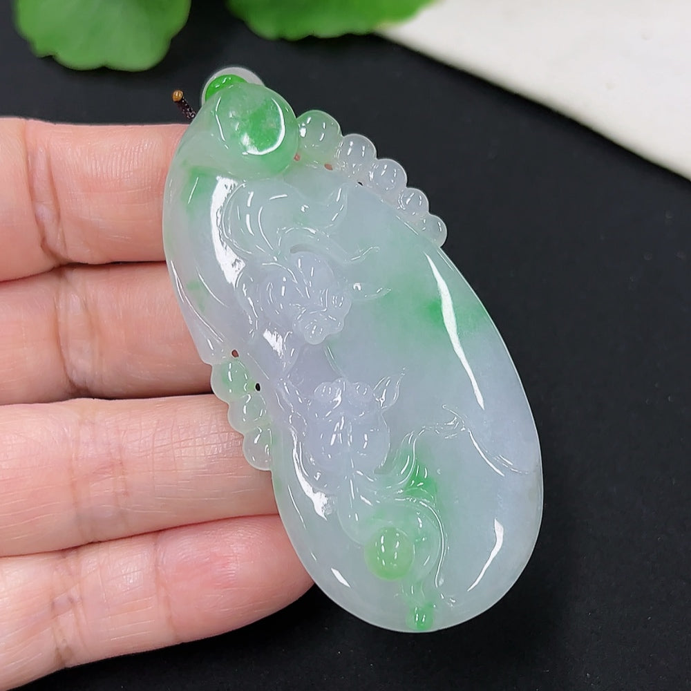 Jadeite goldfish pendant by HKHQ featuring a detailed goldfish design, weighing approximately 30.5g including rope.