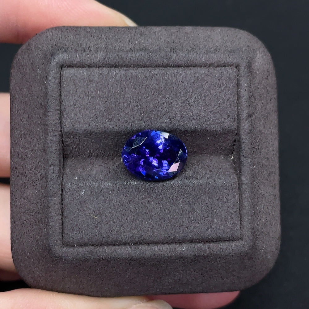 Loose tanzanite gemstone, approximately 4.82 carats, showcasing vibrant blue-purple hues, from HKHQ gemstone collection.