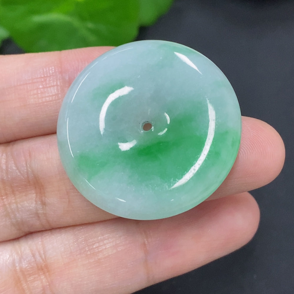 Jadeite safety buckle from HKHQ, weighing approximately 11.7g, showcasing polished green jade with smooth edges and intricate design.