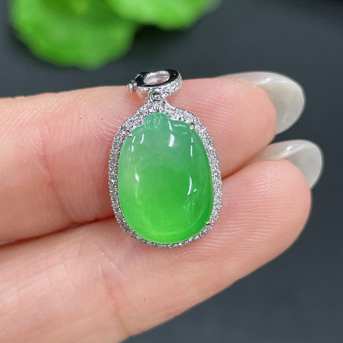 Jadeite pendant with 18k gold inlay and diamond accents, weighing approximately 2.02g, featuring intricate craftsmanship.