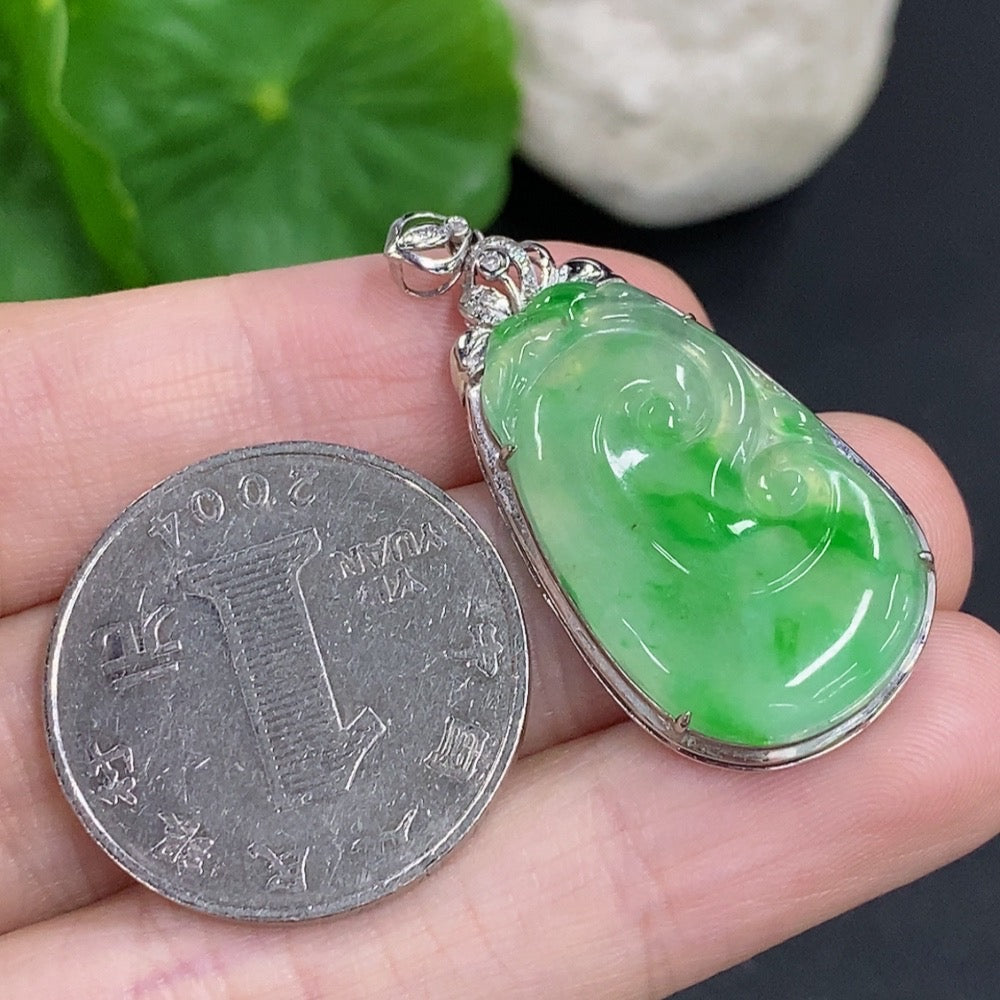 Jadeite Ruyi pendant with diamond accents in 18K gold, weighing approximately 3.9g, featuring a smoothly polished jade design.