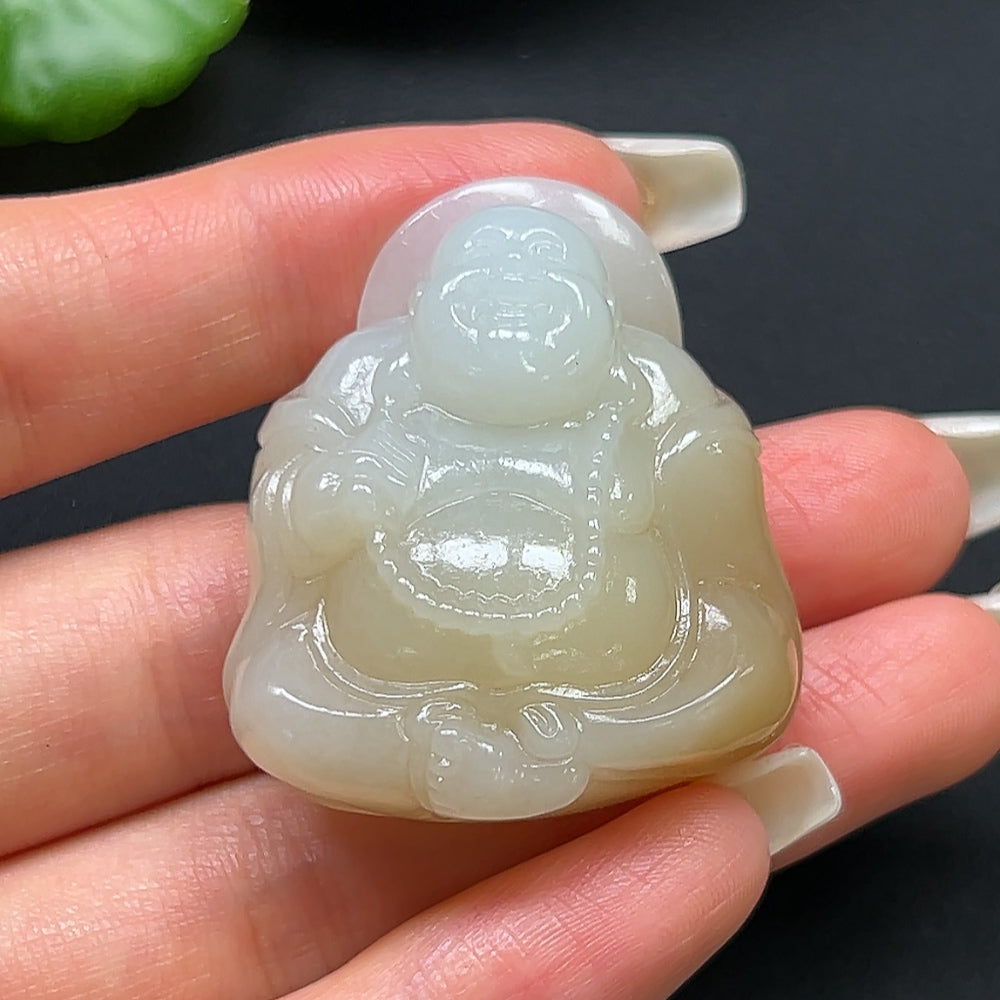 Hetian Jade Buddha pendant necklace featuring a carved jade Buddha, displayed on a delicate chain.