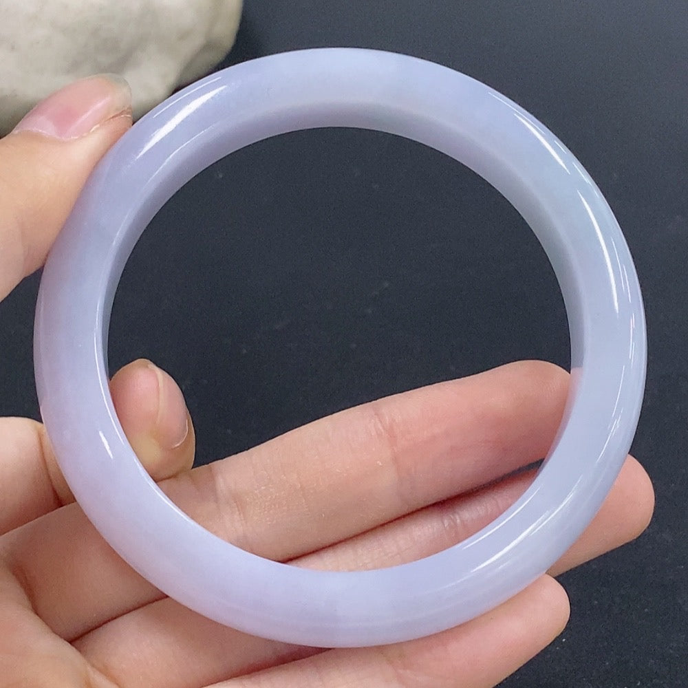 Jadeite round bangle from HKHQ with size 56.1 and weight 53.9g, showcasing smooth, polished green jade surface.