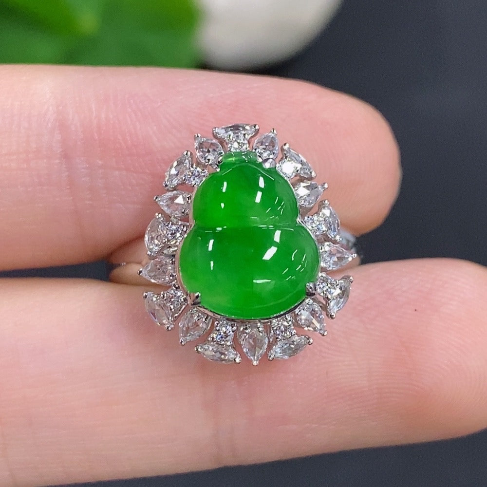 Jadeite gourd inlay ring by HKHQ featuring 18K gold band and diamond accents, showcasing intricate craftsmanship and elegant design.