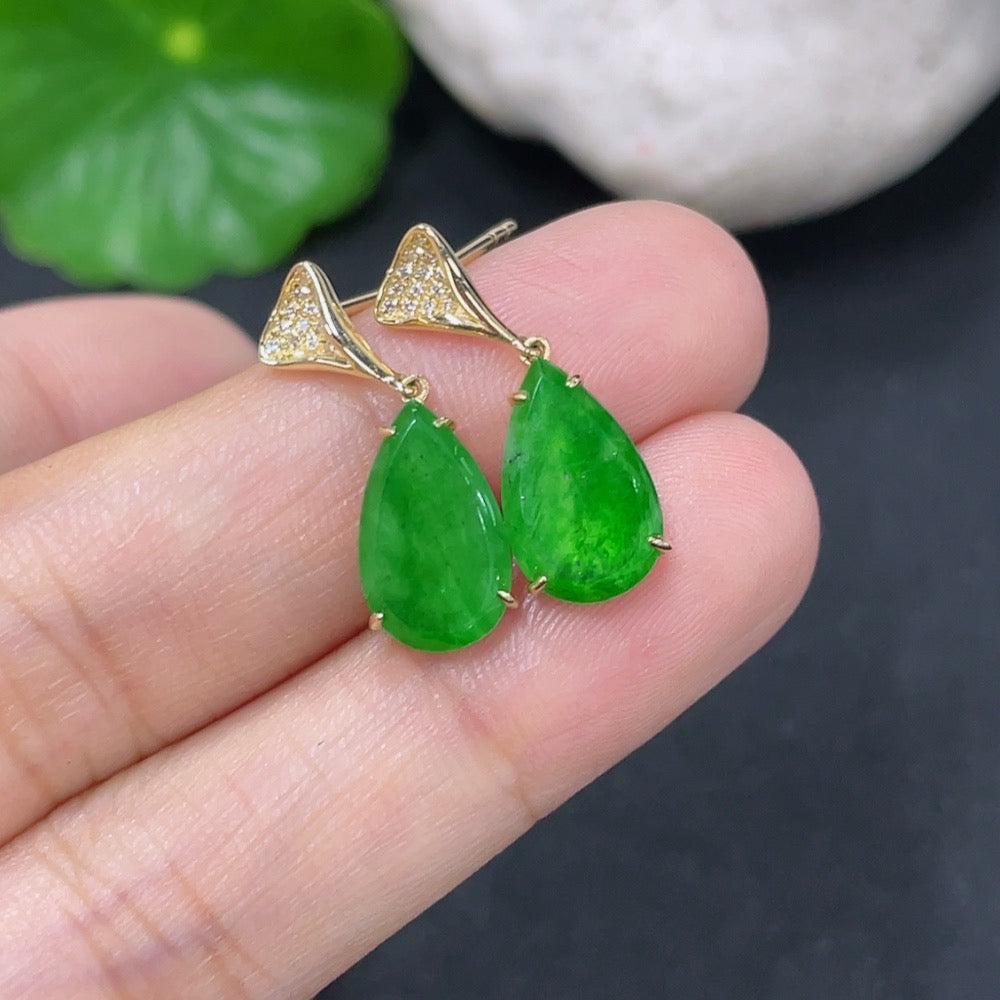 HKHQ jadeite earrings with 18k gold and diamond accents, featuring polished jade stones and delicate gold hooks.