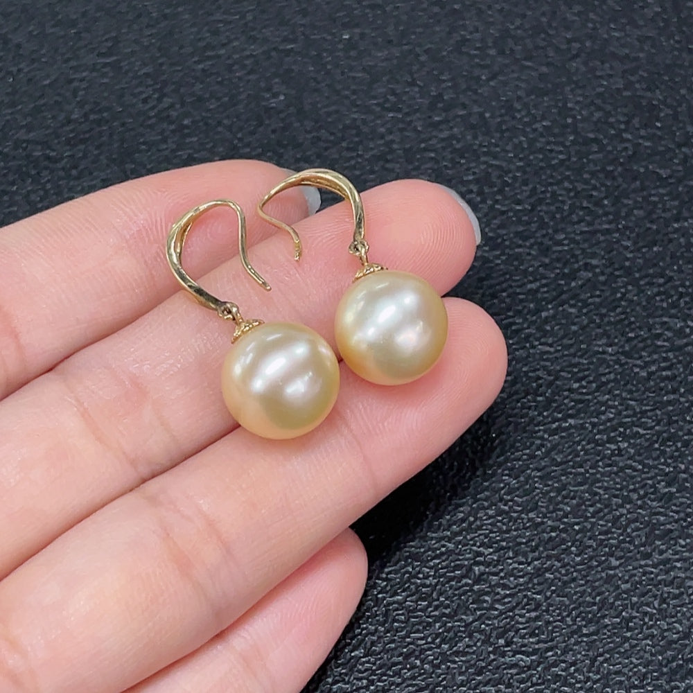 HKHQ seawater pearl earrings with gold, featuring 11.2mm pearls and a natural, elegant design.