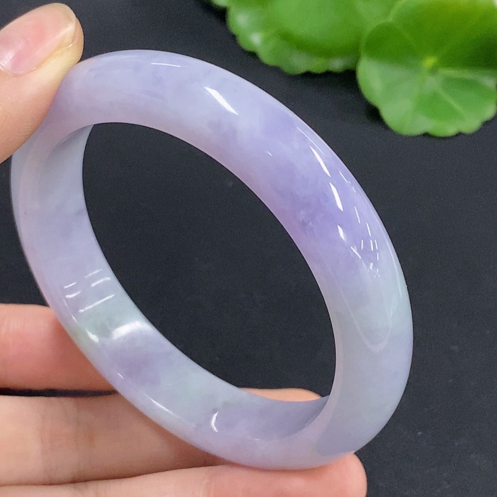 Jadeite round bangle from HKHQ, size 56.7, featuring a smooth, polished surface with a natural green jade color.