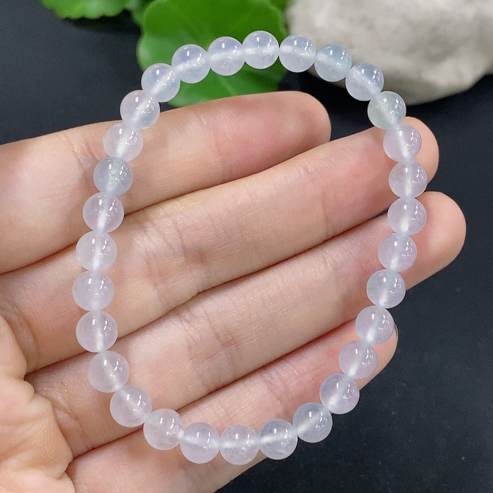 Jadeite bracelet by HKHQ featuring 5.9mm smooth jade beads, total weight approximately 10.8 grams, showcasing elegant craftsmanship.