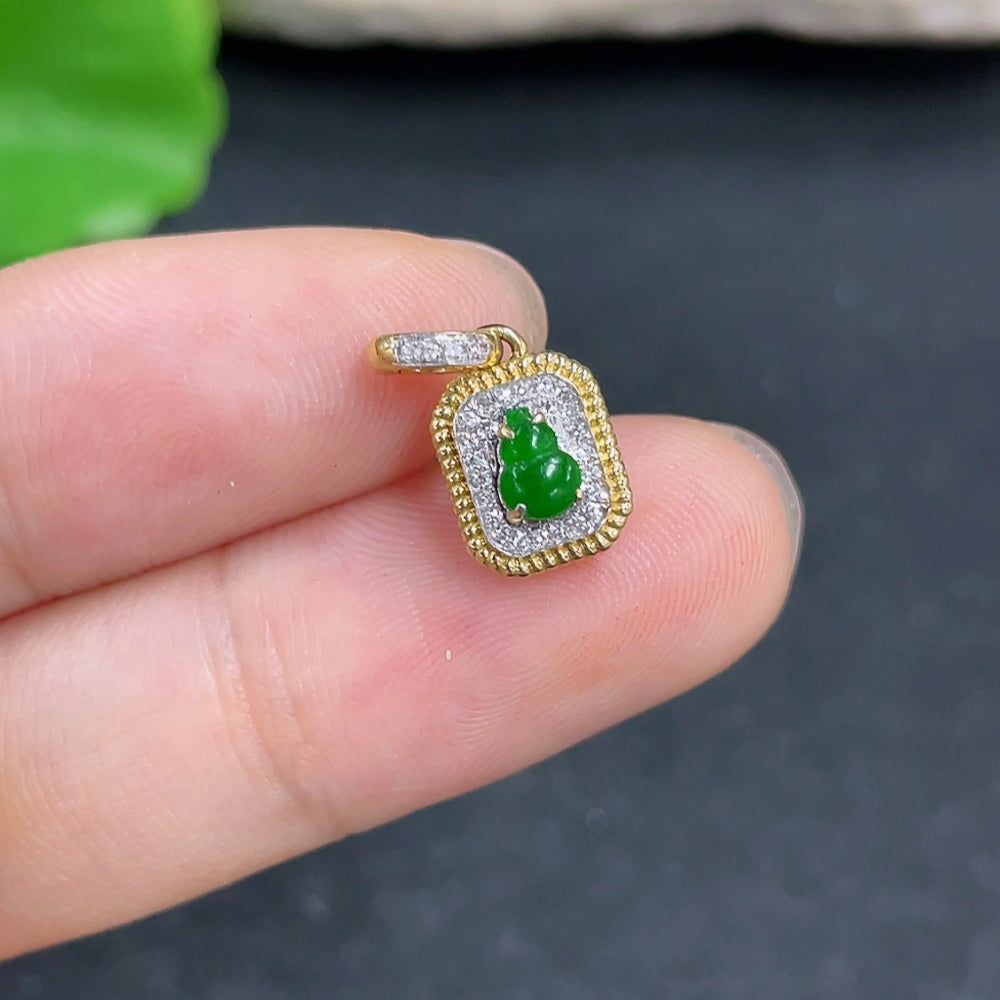 Jadeite gourd pendant with 18k gold and diamond accents, showcasing intricate inlay work and a polished finish.