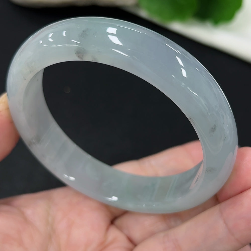 HKHQ jadeite round bangle in size 59.1 with an approximate weight of 65.8g, showcasing the smooth, polished jade surface.