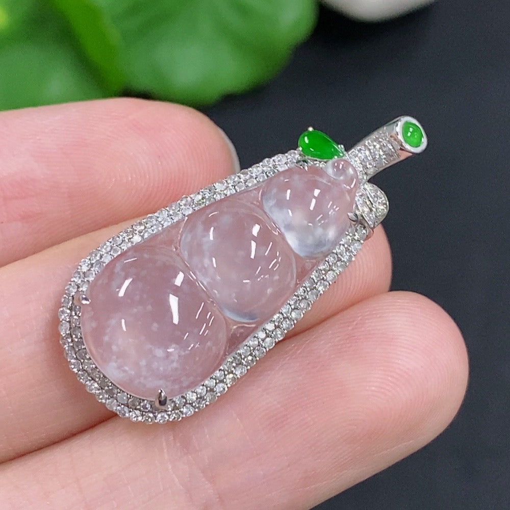 Jadeite lucky bean pendant with 18K gold accents and diamond details, showcasing a smooth jade surface and intricate craftsmanship.