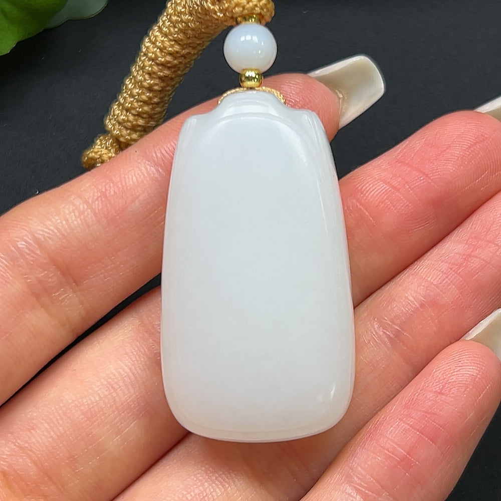 HKHQ Hetian jade plain pendant with rope, approximately 27.31g, showcasing smooth, polished jade surface and elegant design.