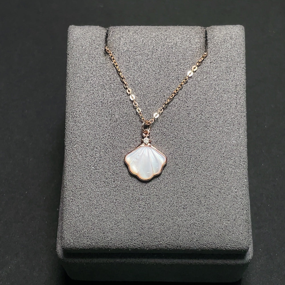 Shell pendant with diamond accents, 18K gold chain (pendant not gold), total weight approximately 2.72g including chain