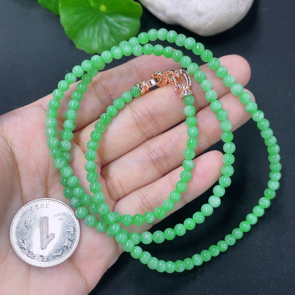 HKHQ jadeite bead necklace with non-gold clasp, 17.87g, featuring smooth, polished green jade beads on a sleek jewelry strand.