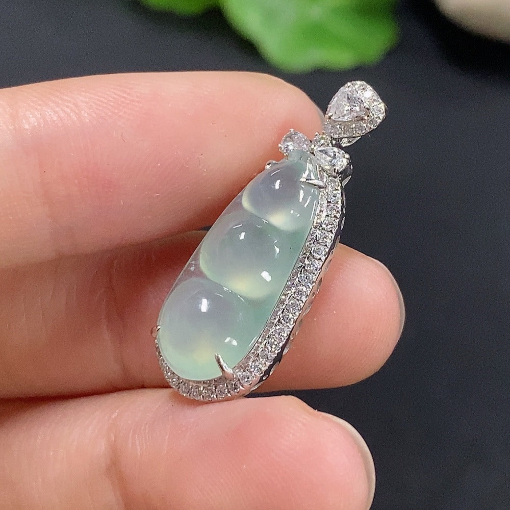 Jadeite lucky bean pendant with inlaid design, 18k gold, from HKHQ, weight approximately 2.68g, detailed close-up image.