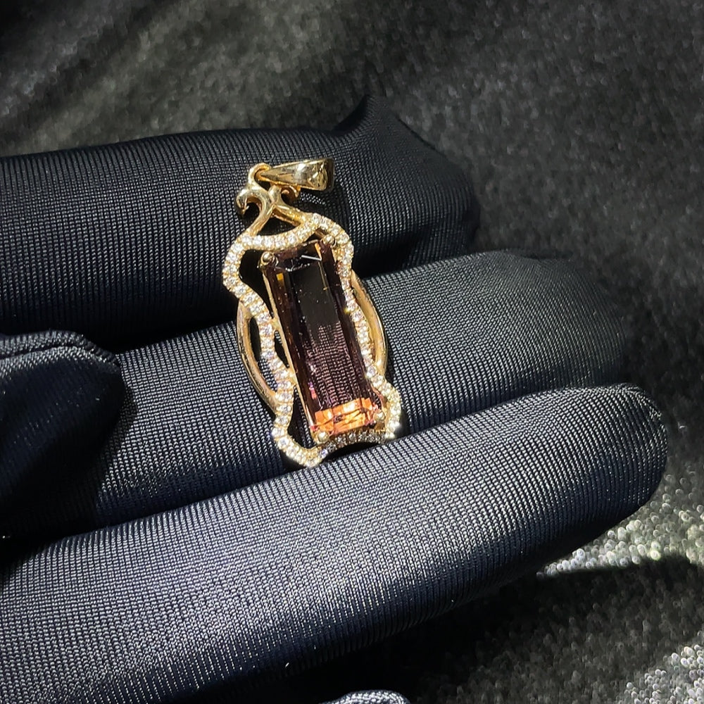 Tourmaline inlaid pendant with 18k gold setting, showcasing vibrant gemstones and elegant craftsmanship.