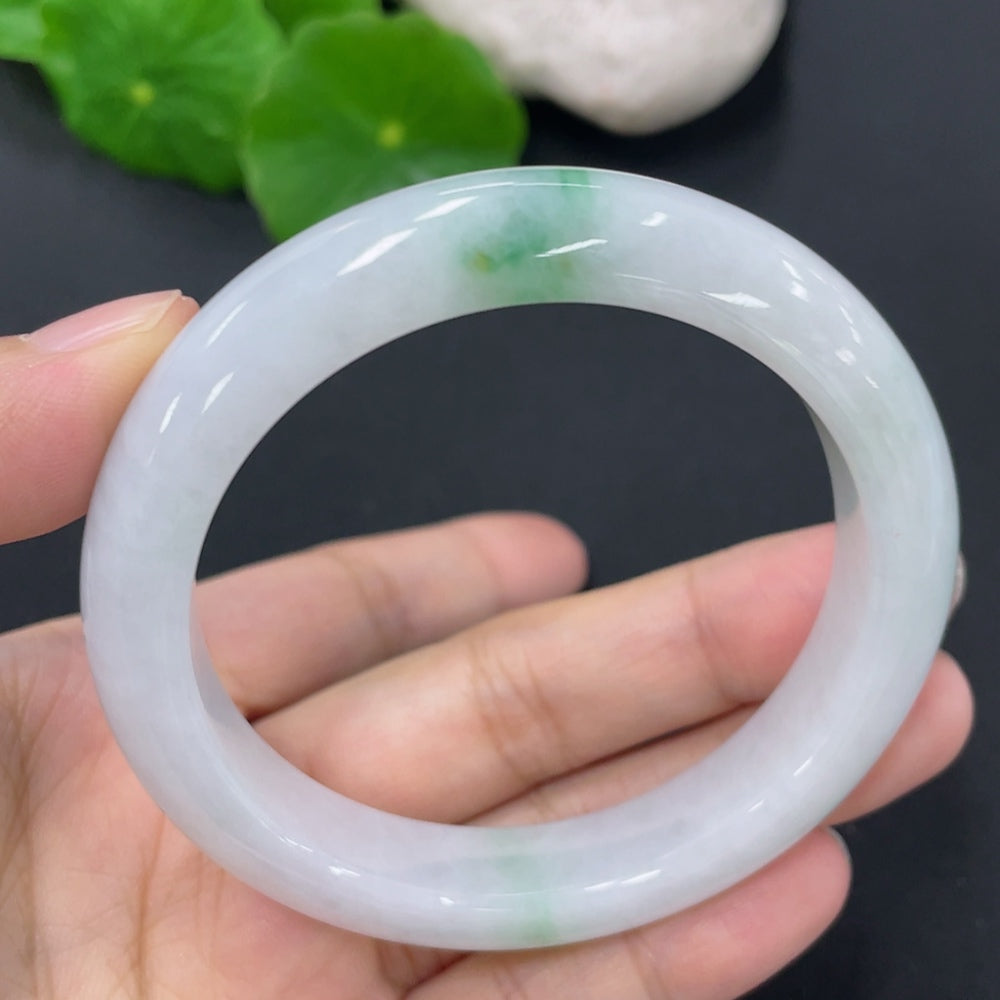 Jadeite round bangle from HKHQ, 52.5mm size, weighing approximately 46g, featuring smooth, polished jadeite surface.