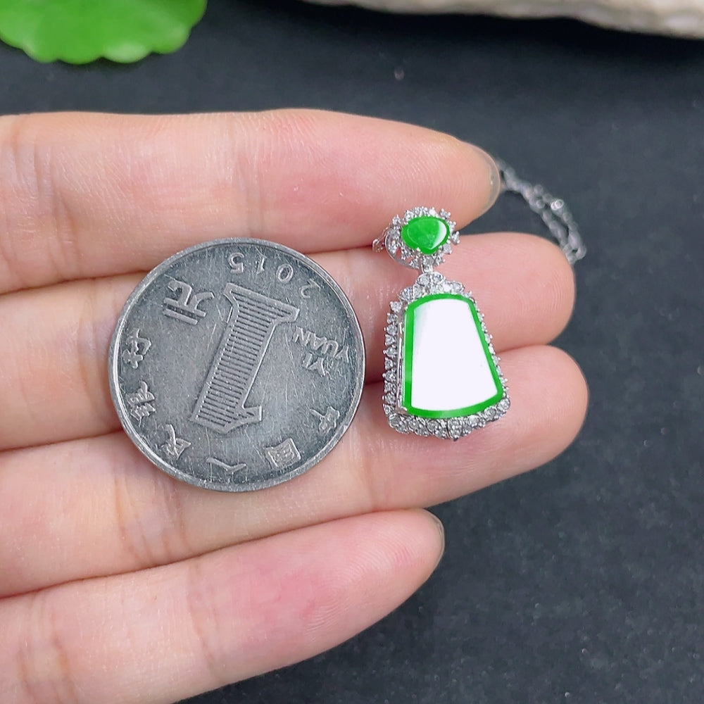 Jadeite pendant with 18K gold accents and diamond details, featuring a smooth jade stone on a delicate chain.