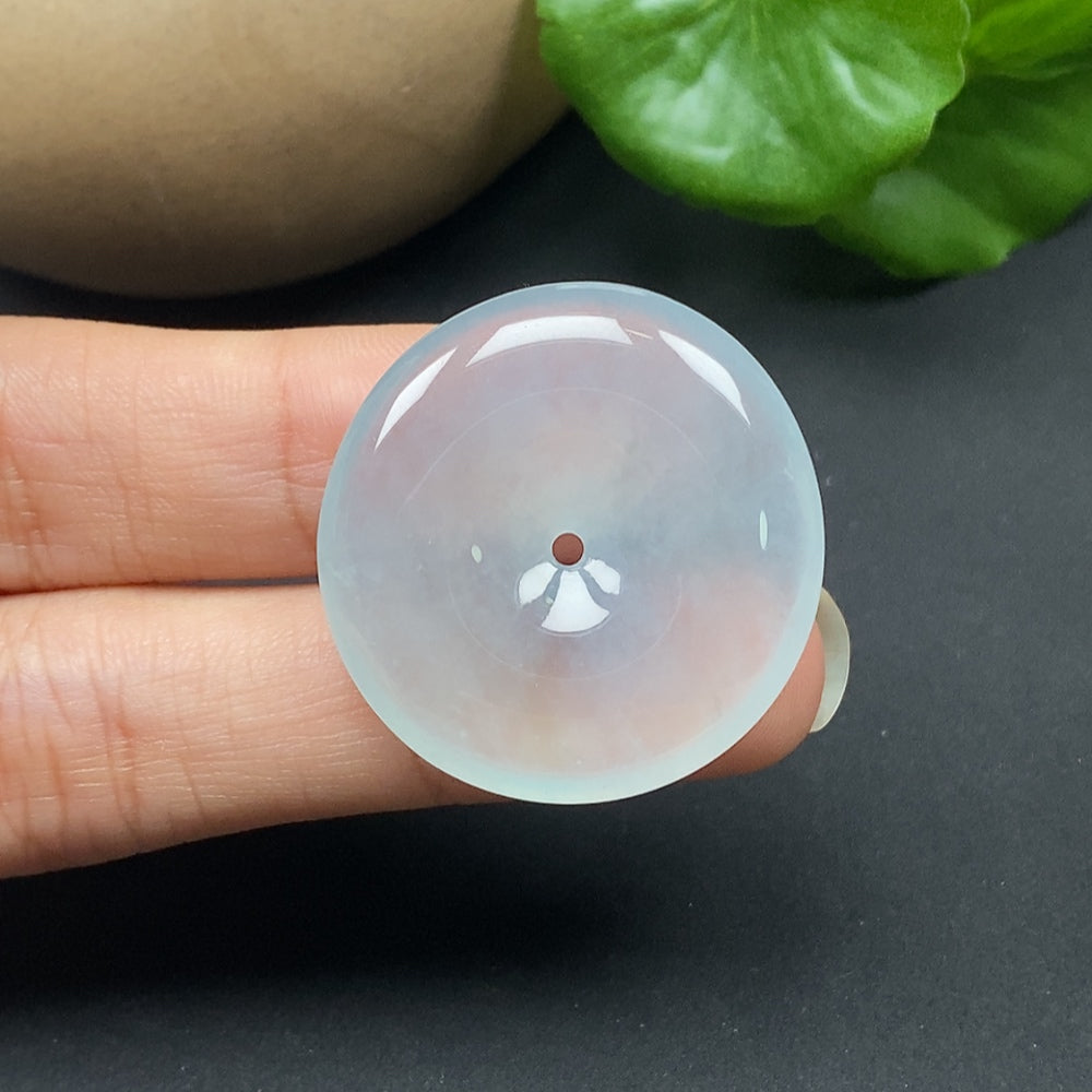 Jadeite pendant with safety buckle, crafted from polished jade, weighing approximately 11.42g, showcasing smooth, vibrant green jade.
