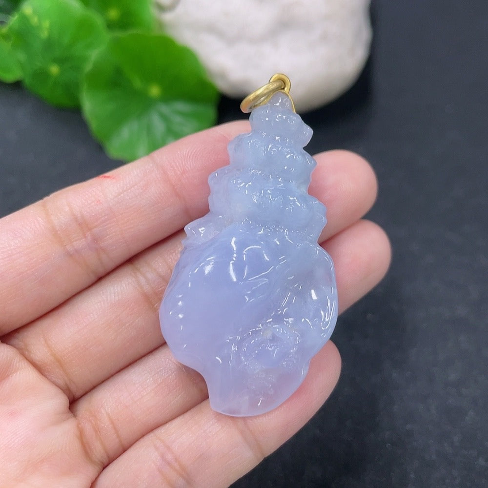 Jadeite inlaid pendant with 18k gold, weighing approximately 21.84 grams, featuring intricate jade detailing.