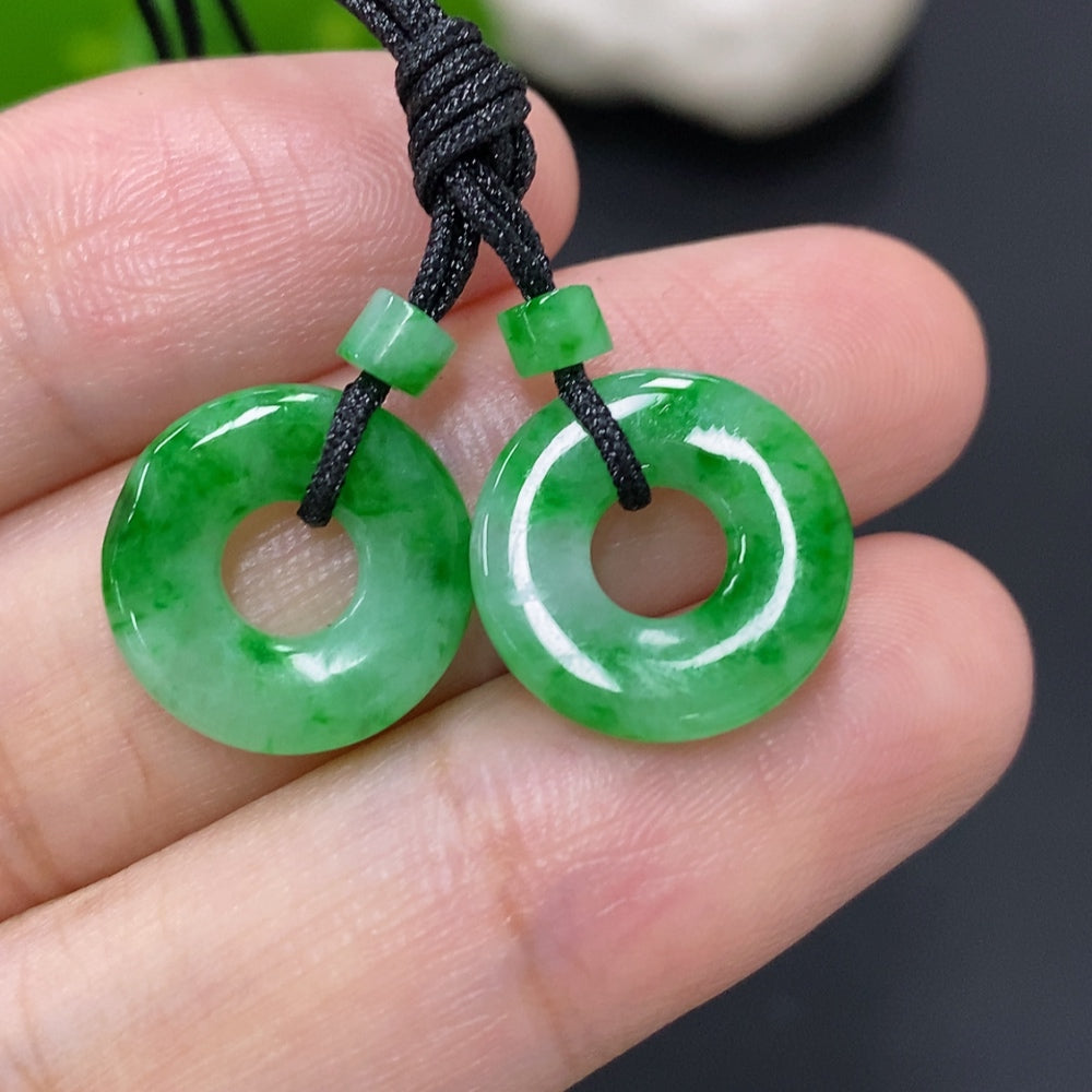 Set of jadeite donut pendants for necklaces, natural green stones, each weighing around 2.3g, displayed on a white background.