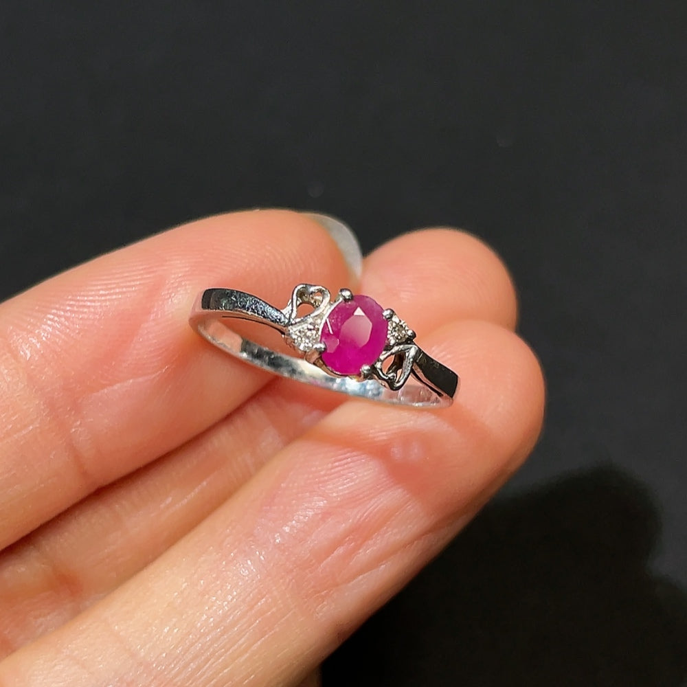 HKHQ ruby ring with diamond accents, platinum 87%, size 14, showcasing a vibrant ruby gemstone and sparkling diamond details.