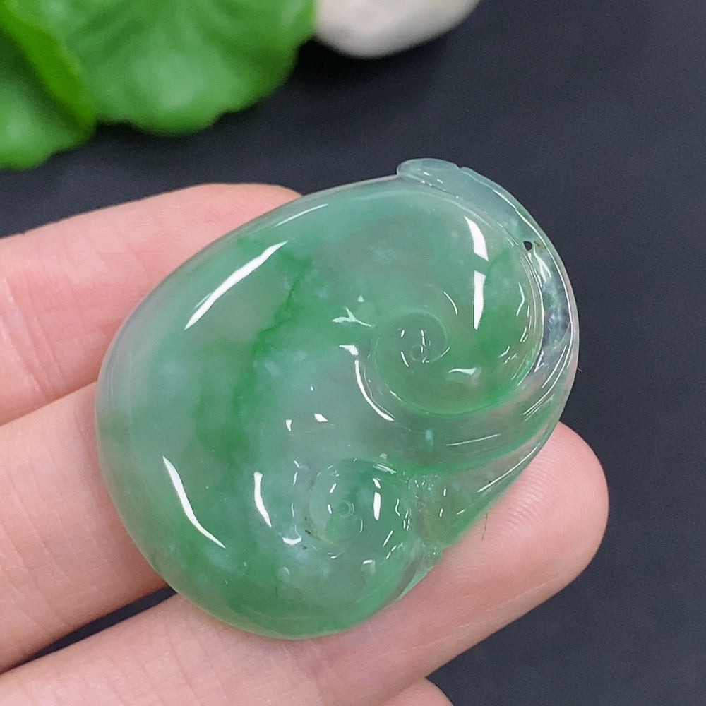 Jadeite Ruyi pendant from HKHQ, smooth green jade with carved details, weighing approximately 10.5 grams.